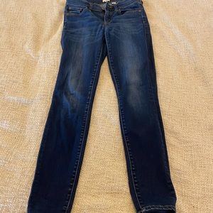 Mid rise dark wash skinny jeans